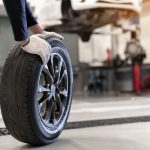 Logel's mechanic replacing a car tire.