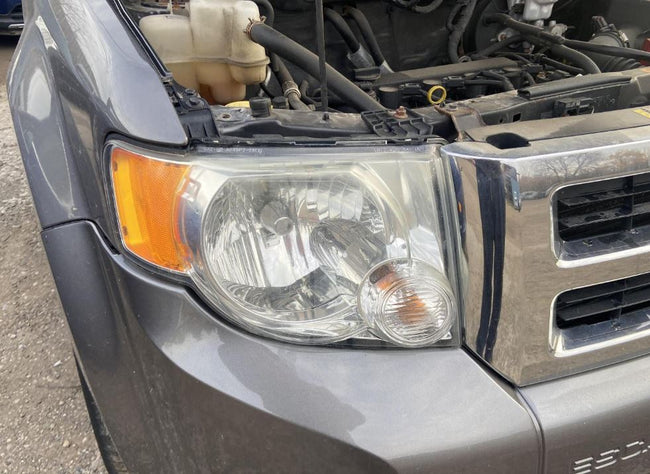 Used OEM RH Headlight fits 2008-2012 Ford Escape 8L8Z13008A